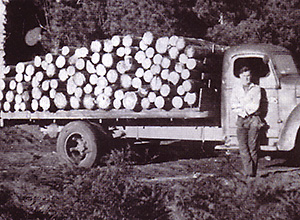 K5 International truck loaded with 8ft logs
